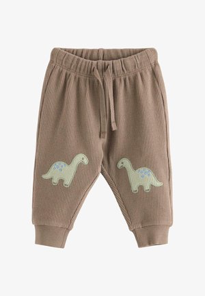 Ruskeat vauvojen housut tekstuurillisesta kankaasta, joustavalla vyötäröllä, kiristysnauhalla ja vihreillä dinosauruspaikoilla polvien kohdalla.