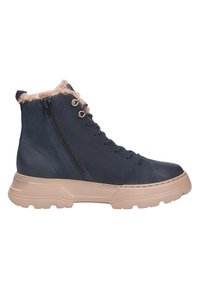 Baskets montantes bleu foncé avec semelle épaisse beige, fermeture éclair latérale, laçage à l'avant et doublure en fourrure beige visible au col de la cheville.
