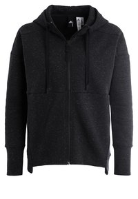 Sweat à capuche zippé noir en tissu texturé avec un motif moucheté, doté d'une capuche, de cordons ajustables et de poches avant.