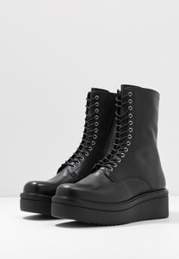 Vagabond Botines con plataforma - black