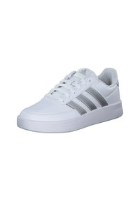 White athletic shoe made of smooth synthetic material with three silver stripes on the side and a cushioned white sole.