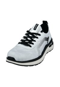 White athletic shoe with black laces, a textured upper, and a black accent along the sole. Features a padded collar and a pull tab.