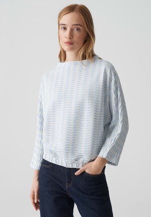 Blau-weiße gestreifte, locker sitzende Bluse mit rundem Ausschnitt, langen Ärmeln und gerafftem Saum. Der Stoff hat eine strukturierte Optik.
