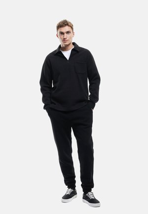 JOGGER  - Träningsbyxor - black