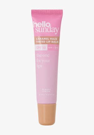 Tube de baume à lèvres teinté Hello Sunday Caramel Haze avec SPF 50, protection UVB+UVA, finition brillante et contenu de 15 ml sur un fond uni.
