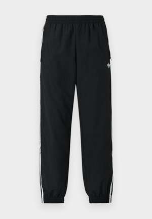 Μαύρο αθλητικό παντελόνι με ελαστική μέση και σούρες στα μανσέτα. Διαθέτει λευκές λωρίδες στο πλάι και ένα μικρό λογότυπο μπροστά αριστερά.