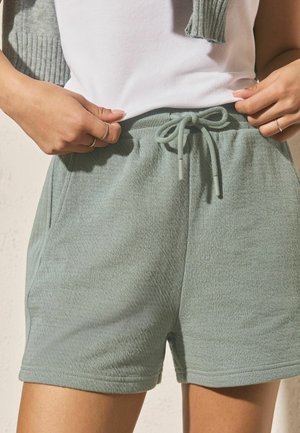 Next, REGULAR FIT - TEXTURED SHORTS . - Tracksuit bottoms - teal blue