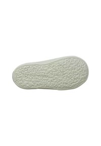 Sole in gomma bianca con superficie testurizzata e motivi circolari. Presenta il logo "SUPERGA" impresso sul fondo.