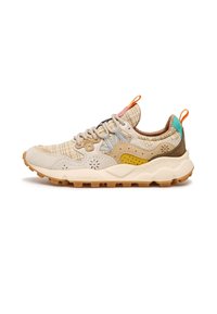 Beige athletic shoe with a textured upper, mixed materials, patterned accents, and a rugged sole. Features multi-colored heel and laces.