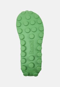 Green rubber shoe sole featuring a rounded, textured design with circular bumps. The brand "CAMPER" is embossed centrally.