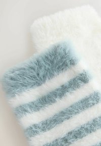 Fluffy socks featuring a light blue base with white stripes and a soft texture. One sock is white and the other has light blue accents.