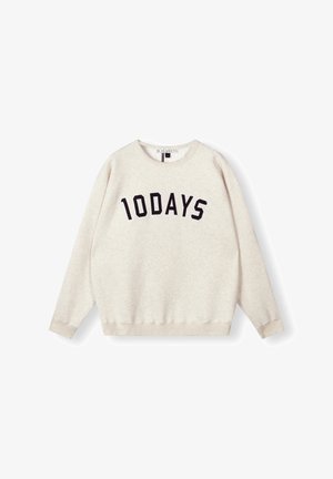 Sudadera beige con cuello redondo, mangas largas y un corte relajado. Presenta un atrevido texto en negro "10DAYS" en el pecho. Textura suave.