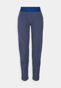 Marinblå byxor med ett mönstrat, elastiskt midjeband. Har smalnande ben och sidofickor. Tillverkade av ett hållbart, slätt tyg.