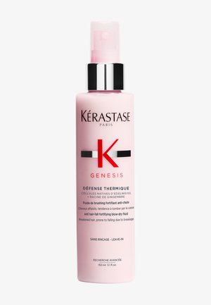 Kérastase Genesis Défense Thermique leave-in fluid i en lyserød flaske med sorte og sølvfarvede accenter, 150 ml, anti-hårtab formel.