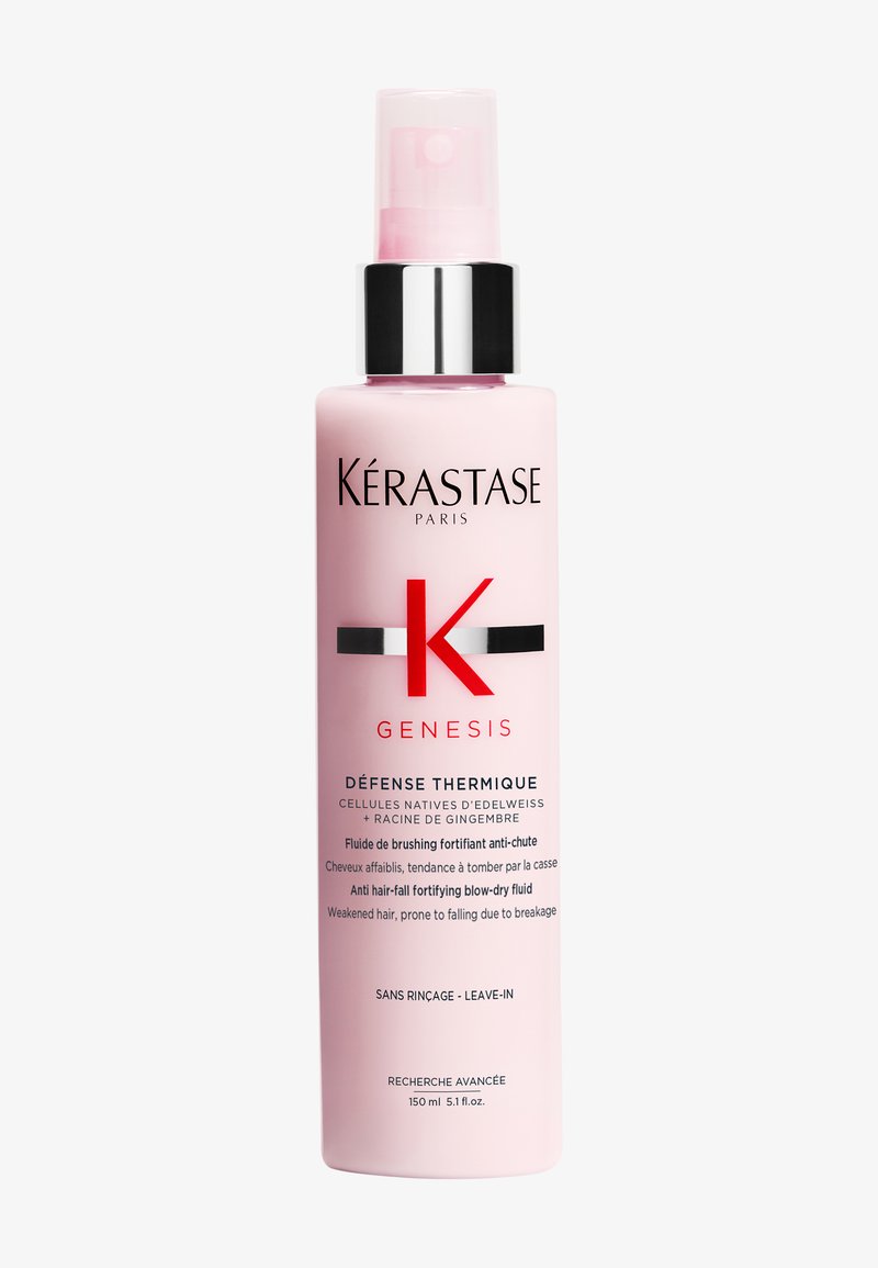Kérastase Genesis Défense Thermique leave-in fluid i en rosa flaske med svarte og sølvfargede detaljer, 150 ml, formula mot hårtap.