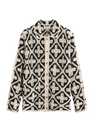 Veste chemise à manches longues avec motif crochet géométrique noir et blanc et col, dotée de boutons en bois sur le devant.