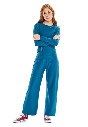 Blue long-sleeve top and loose-fitting pants made of lightweight fabric; features a relaxed fit and a simple design with no patterns.