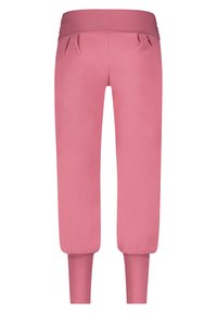 Rosa Baumwoll-Jogginghosen verfügen über einen breiten, elastischen Bund, einen gefältelten Vorderbereich und eng zulaufende Bündchen am Knöchel. Weiche, glatte Textur im gesamten Produkt.
