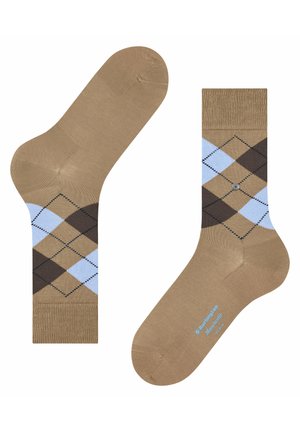 Tan socks featuring an argyle pattern with light blue and brown diamonds, ribbed cuff, and smooth texture with logo detail on the sole.