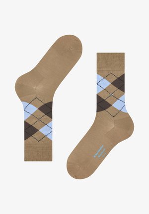 Chaussettes beiges avec un motif argyle en diamants bleu clair et marron, une bordure côtelée, une texture lisse et un détail de logo sur la semelle.