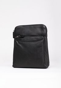 Black leather bag with a smooth texture, zippered main compartment, and a front pocket. Square shape with subtle embossed logo detail.