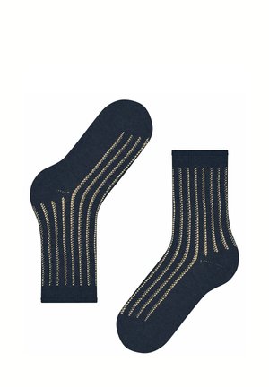 Een paar donkerblauwe sokken met verticale beige gestippelde strepen, één sok plat en één vanaf de zijkant getoond op een witte achtergrond.