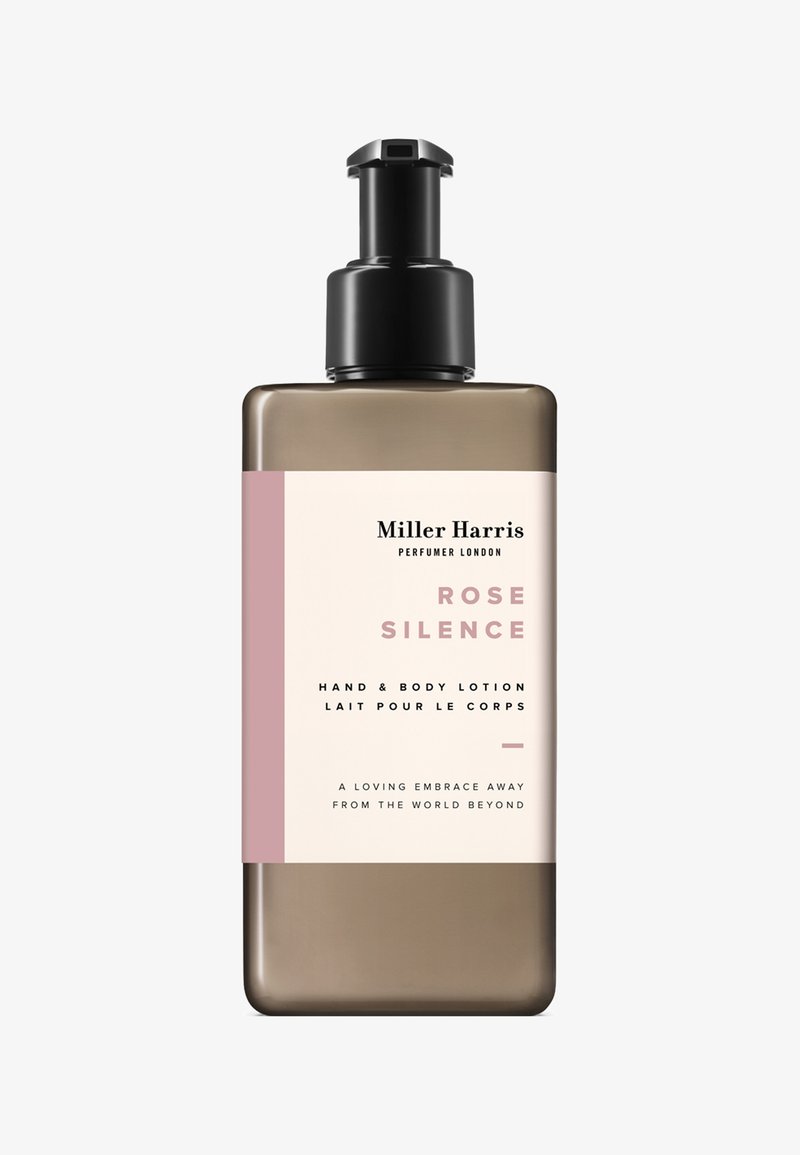 Flacon-pompe marron de lotion pour les mains et le corps Miller Harris Rose Silence avec étiquette rose et crème.