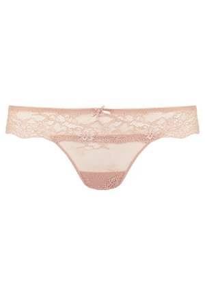 Syndesnor i blød nude farve. Har blomstret blonde, uigennemsigtig frontpanel og satinbue detalje på taljebåndet. Justerbare elastiske sider.