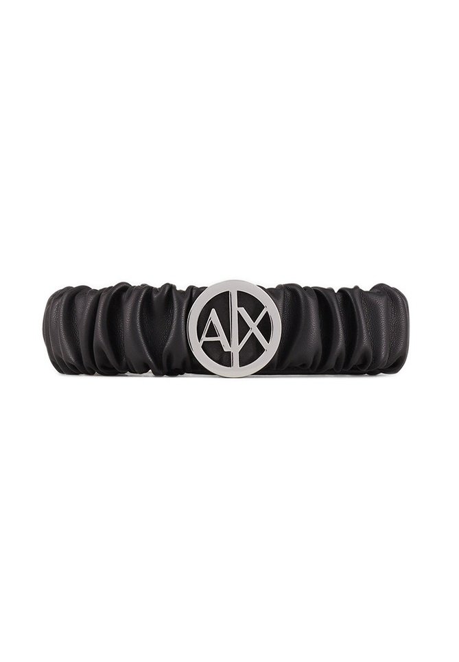 Accessorio per capelli in pelle nera con design arricciato. Presenta un accento con logo argento al centro, che evidenzia una forma circolare.