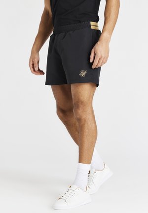 SUPREMACY - Shorts - black/gold
