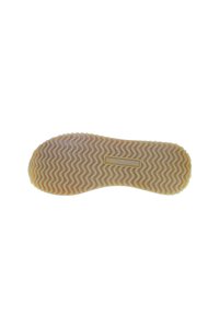 Suela de zapato de goma con textura ondulada, en color beige claro con sutiles toques de rosa. La etiqueta dice "U.S. Polo Assn."