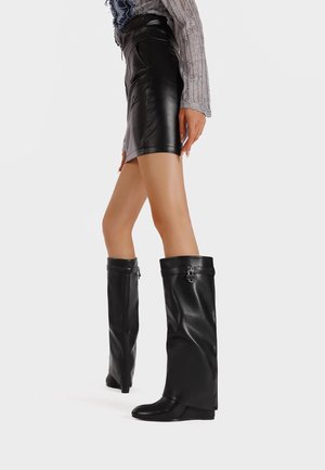 Laarzen met sleehak - black