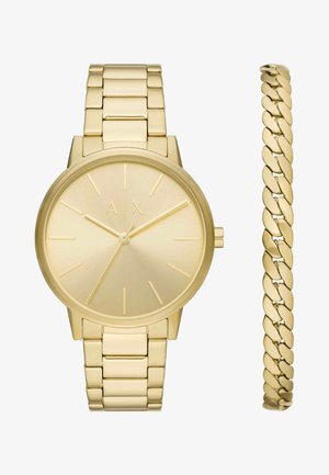 Złoty zegarek na rękę z minimalistyczną tarczą i złotą bransoletą z ogniw, zestawiony z dopasowaną złotą bransoletką łańcuszkową.