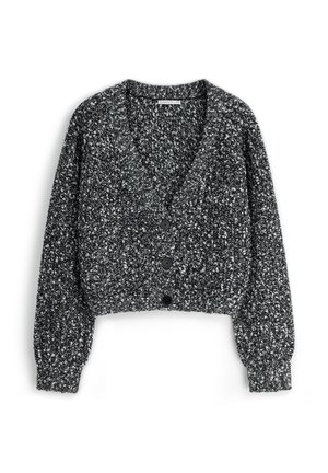 Krótki kardigan w czarno-białym melanżowym wzorze. Posiada głęboki dekolt w kształcie litery V, długie bufiaste rękawy oraz sześć czarnych guzików z przodu.