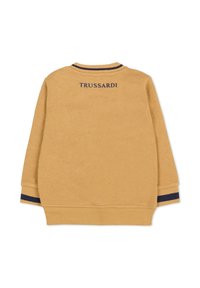 Felpa gialla con polsini e orlo a costine, arricchita da dettagli blu navy. Logo "TRUSSARDI" in blu navy sul retro. Realizzata in morbido cotone.