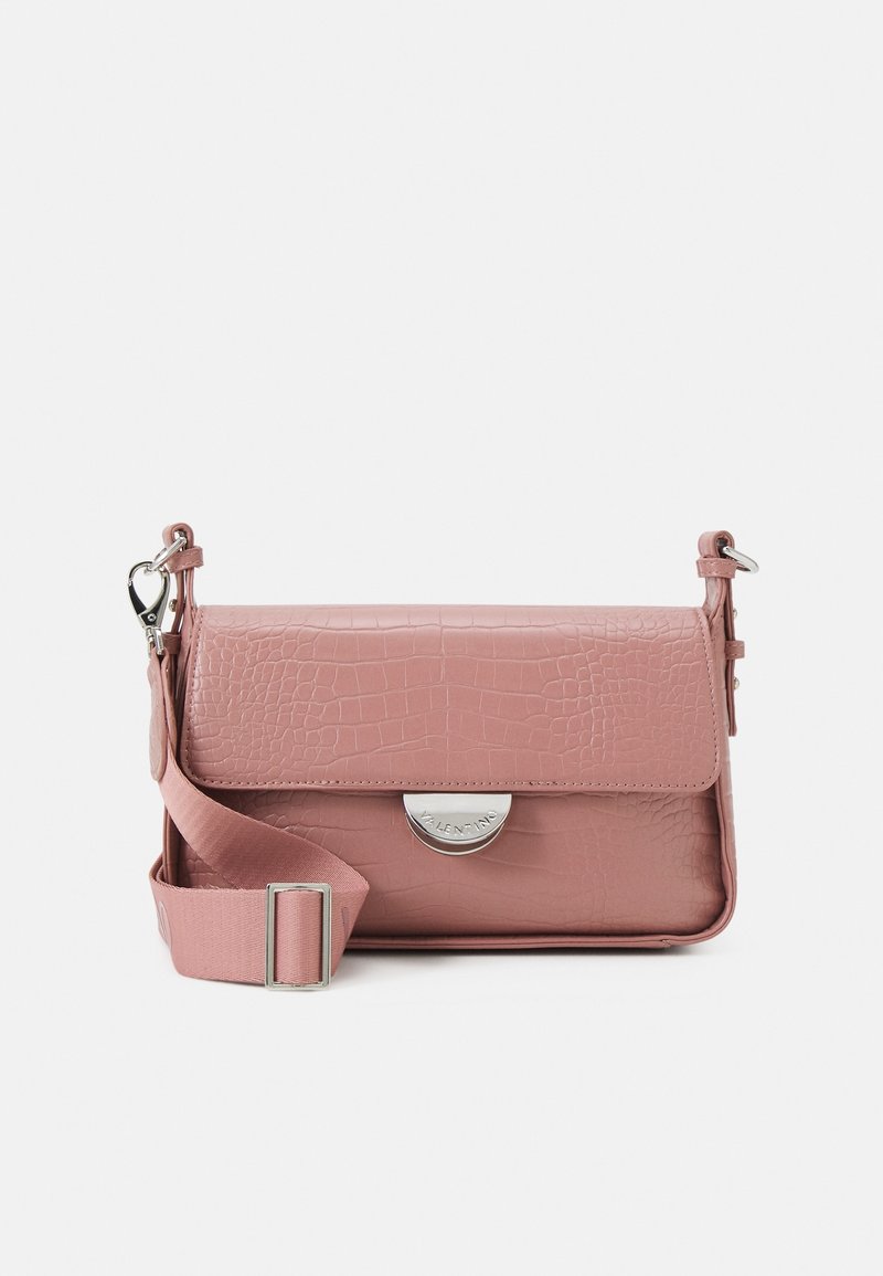 Crocodile-textured pink leather handbag with a flap closure, silver hardware, and a detachable shoulder strap. Features a circular logo detail.