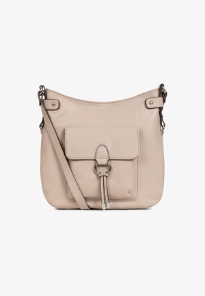 Beige leather crossbody bag with a front pocket, silver hardware, adjustable strap, and smooth texture. Notable ring accent on the pocket flap.