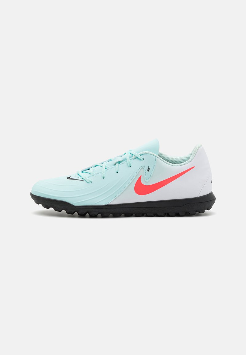 Sport shoes featuring a light blue upper, textured design, pink Nike swoosh accent, black outsole with traction studs, and flat laces.