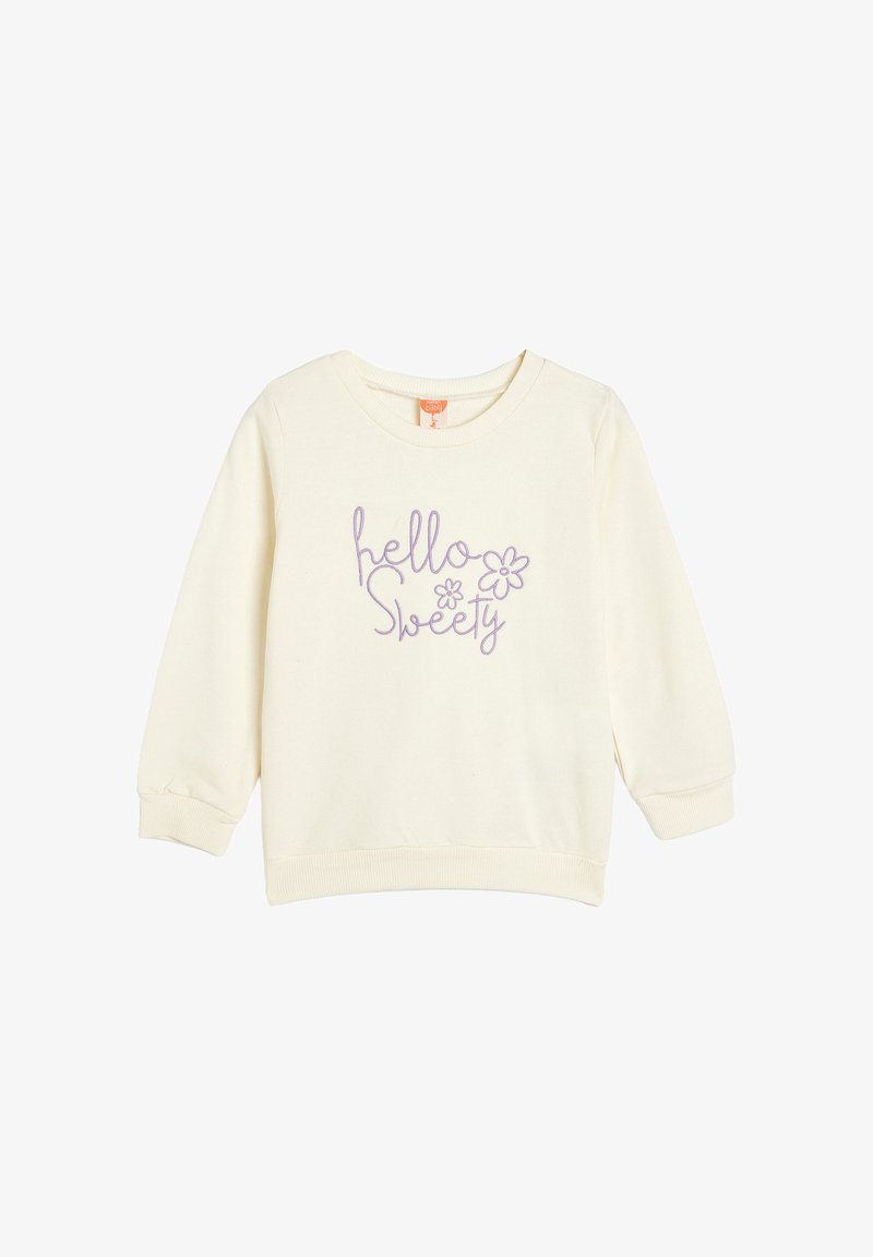 Sudadera color crema con mangas largas, que presenta el texto bordado en púrpura "hola Dulce" y dos diseños de flores en el frente.