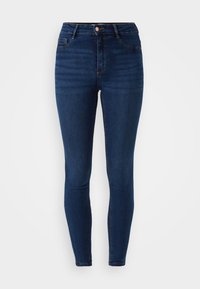 Tmavě modré skinny džíny vyrobené z denimu, s vysokým pasem, předními kapsami a zipovým zapínáním na kovový knoflík.