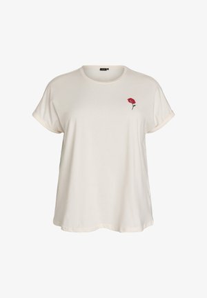 Licht beige T-shirt gemaakt van zachte stof. Heeft opgerolde mouwen en een kleine rode rozenborduring op het linkerborstgebied.