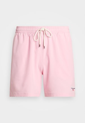 Rosa svømmebukser laget av lett stoff, med elastisk liv med snøring og en liten logo detalj på siden.