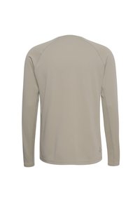 Beżowa teksturowana koszula z długim rękawem i rękawami raglanowymi, pokazana od tyłu na białym tle.