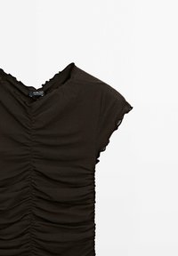 Black short-sleeve top with ruched texture and ruffled neckline. Made from soft, stretchy fabric. Tag visible inside the collar.