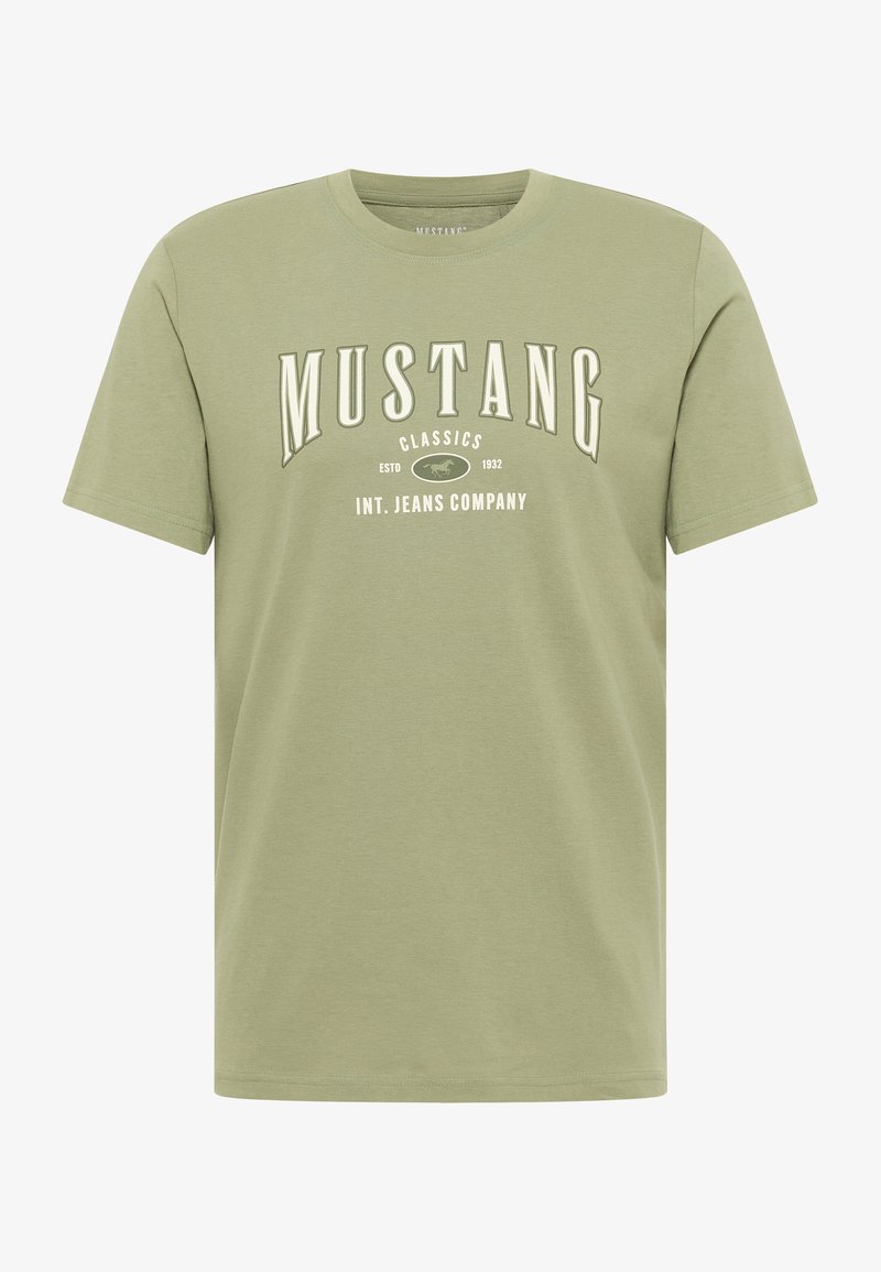 Green cotton t-shirt with short sleeves, featuring "MUSTANG CLASSICS" print in white on the front, round neckline, and relaxed fit.