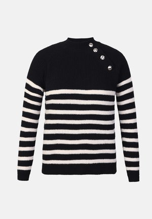 Black and white striped sweater with a ribbed texture, featuring a round neckline and four metal button accents on the left shoulder.