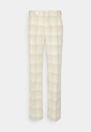 Beżowe spodnie w kratkę wykonane z lekkiego materiału. Posiadają prosty krój nogawki z subtelnym wzorem w kratkę i klasycznym pasem.