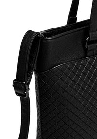 Black leather bag with a textured, quilted pattern. Features a smooth top panel and an adjustable strap with a metal buckle detail.
