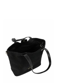 Sac fourre-tout noir en tissu texturé avec poignées en cuir lisse. L'intérieur comprend des poches et une fermeture magnétique. Accents de logo en or.