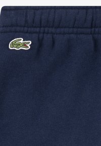 Lacoste CORE PANT UNISEX - Tracksuit bottoms - marine